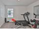 Home gym featuring a treadmill, weight bench, and free weights, ideal for fitness enthusiasts at 5511 Del Coronado Dr, Apollo Beach, FL 33572