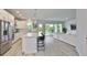 Modern kitchen features stainless steel appliances and a center island with seating at 5511 Del Coronado Dr, Apollo Beach, FL 33572
