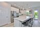 Bright, modern kitchen with stainless appliances and a large island at 5511 Del Coronado Dr, Apollo Beach, FL 33572
