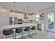 Open-concept kitchen featuring stainless appliances, island with barstool seating at 5511 Del Coronado Dr, Apollo Beach, FL 33572