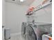Efficient laundry room equipped with modern washer and dryer, storage shelves, and ample counter space at 5511 Del Coronado Dr, Apollo Beach, FL 33572
