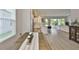 Bright living space with wood-look floors offers a modern and airy feel at 5511 Del Coronado Dr, Apollo Beach, FL 33572