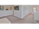 Spacious loft area with neutral walls, gray carpet and large TV, perfect for relaxation or entertainment at 5511 Del Coronado Dr, Apollo Beach, FL 33572