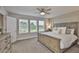 Spacious main bedroom featuring a ceiling fan and large windows with natural light at 5511 Del Coronado Dr, Apollo Beach, FL 33572