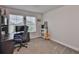 Functional home office setup with a comfortable chair, desk, and ample natural light at 5511 Del Coronado Dr, Apollo Beach, FL 33572