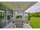 Covered patio with outdoor dining set, ideal for enjoying the serene backyard view at 5511 Del Coronado Dr, Apollo Beach, FL 33572