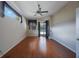 Cozy bedroom with wood floors and sliding doors for outdoor pool view at 5519 Reflections Blvd, Lutz, FL 33558