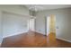 Bright bedroom with vaulted ceiling, wood floors, and an open doorway to a walk-in closet at 5519 Reflections Blvd, Lutz, FL 33558