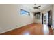 Bedroom with hardwood floors, and a sliding glass door leading to the patio at 5519 Reflections Blvd, Lutz, FL 33558