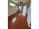 Bright bedroom featuring wood floors, neutral walls, ceiling fan, and natural lighting at 5519 Reflections Blvd, Lutz, FL 33558