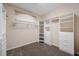 Spacious walk-in closet with custom white shelving and ample storage for an organized wardrobe at 5519 Reflections Blvd, Lutz, FL 33558