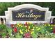Heritage community sign features colorful flowers in foreground at 5519 Reflections Blvd, Lutz, FL 33558