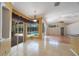 Open kitchen with access to an outdoor pool area at 5519 Reflections Blvd, Lutz, FL 33558