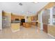 Bright kitchen features an island and tile flooring at 5519 Reflections Blvd, Lutz, FL 33558