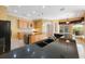 Spacious kitchen featuring granite countertops and stainless steel sink at 5519 Reflections Blvd, Lutz, FL 33558