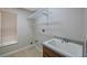 Utility room with sink, shelving, and window at 5519 Reflections Blvd, Lutz, FL 33558