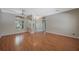 Spacious living room with hardwood floors and elegant lighting fixture at 5519 Reflections Blvd, Lutz, FL 33558