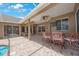 An elegant outdoor patio with bar, ceiling fans, and tiled floor offers space for entertaining at 5519 Reflections Blvd, Lutz, FL 33558