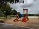 Community playground featuring slides and swings with a nice playground covering at 5519 Reflections Blvd, Lutz, FL 33558
