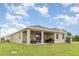 The spacious backyard of this home features a covered patio perfect for outdoor relaxation and entertainment at 5620 Night Owl Ter, Palmetto, FL 34221