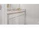 Bathroom with granite counters, white cabinets, and a decorative plant at 5620 Night Owl Ter, Palmetto, FL 34221