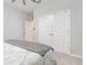 Bright bedroom featuring double closet, neutral walls, and plush carpeting at 5620 Night Owl Ter, Palmetto, FL 34221