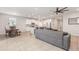 Spacious open-concept living room flowing into the modern kitchen and dining area, with ample natural light at 5620 Night Owl Ter, Palmetto, FL 34221