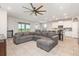 Spacious open-concept living room flowing into the modern kitchen and dining area, with ample natural light at 5620 Night Owl Ter, Palmetto, FL 34221