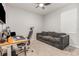 Functional home office with a comfortable sofa, ergonomic chair, and plenty of natural light at 5620 Night Owl Ter, Palmetto, FL 34221