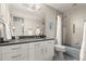 This bathroom features a single sink with granite countertop and tiled shower with grab bar at 5782 Westshore Dr, New Port Richey, FL 34652