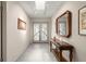 Bright foyer with skylight and mosaic tile floor leads to the main living area at 5782 Westshore Dr, New Port Richey, FL 34652
