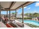 Relaxing screened lanai with a pool overlooking the serene waterfront at 5782 Westshore Dr, New Port Richey, FL 34652