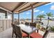 Covered and enclosed lanai features waterfront views and seating for six at 5782 Westshore Dr, New Port Richey, FL 34652