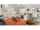Inviting living room with a spiral staircase and open floor plan to kitchen at 5782 Westshore Dr, New Port Richey, FL 34652