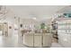 Spacious living room with a spiral staircase and view of the waterfront at 5782 Westshore Dr, New Port Richey, FL 34652