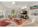 Bright living room featuring a fireplace and views of the waterfront at 5782 Westshore Dr, New Port Richey, FL 34652