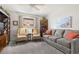 Cozy living room with comfortable seating, carpeted floors, and bright natural light at 5782 Westshore Dr, New Port Richey, FL 34652