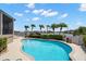 A beautiful private pool overlooks the water and neighborhood landscaping at 5782 Westshore Dr, New Port Richey, FL 34652