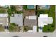 Overhead view displaying residential properties with driveways, landscaped yards, and varying roof colors within a neighborhood at 5840 Liddell Dr, New Port Richey, FL 34652