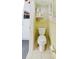 Small bathroom with retro yellow tiles, toilet, and minimal storage at 5840 Liddell Dr, New Port Richey, FL 34652