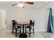 Eating area with high-backed chairs sits near a large window at 5840 Liddell Dr, New Port Richey, FL 34652