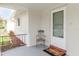 Quaint front porch with a chair and a welcoming entrance at 5840 Liddell Dr, New Port Richey, FL 34652