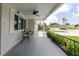 Inviting front porch featuring a ceiling fan and seating area at 5840 Liddell Dr, New Port Richey, FL 34652