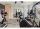 Home gym featuring exercise equipment and sliding glass doors, creating a perfect fitness space at 5840 Liddell Dr, New Port Richey, FL 34652