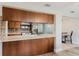 Kitchen includes stainless appliances, plenty of cabinets, and breakfast bar in an open floor plan at 5840 Liddell Dr, New Port Richey, FL 34652
