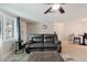 Inviting living room features a plush leather sofa and lots of natural light from the picture window at 5840 Liddell Dr, New Port Richey, FL 34652