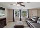 Living room with tile flooring and large window, showing the exterior of the home at 5840 Liddell Dr, New Port Richey, FL 34652