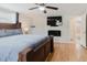 Bright and spacious bedroom with an ensuite bathroom, a ceiling fan, and warm lighting at 5840 Liddell Dr, New Port Richey, FL 34652