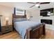 Well-lit bedroom with hardwood floors, ceiling fan, and side tables, providing an inviting atmosphere at 5840 Liddell Dr, New Port Richey, FL 34652