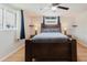 Airy bedroom featuring hardwood floors, large bed, and windows, perfect for relaxation and rest at 5840 Liddell Dr, New Port Richey, FL 34652